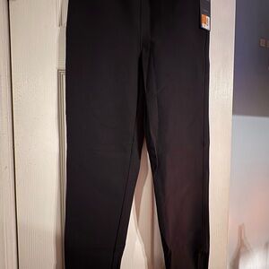 Spanx the back zip women’s black pants. Zip at ankle and back at waist. Size 4